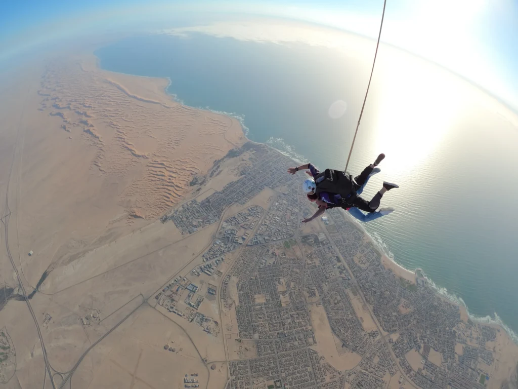 Tandem skydive falling over Swakopmund town and desert coastline