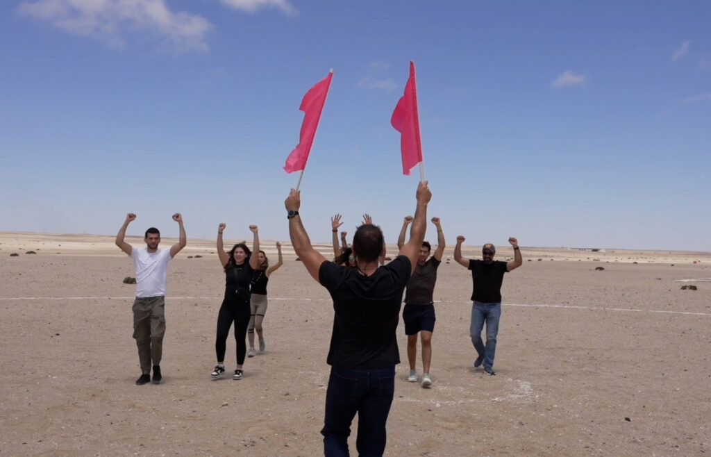 AFF students practicing landing and emergency signals on the ground