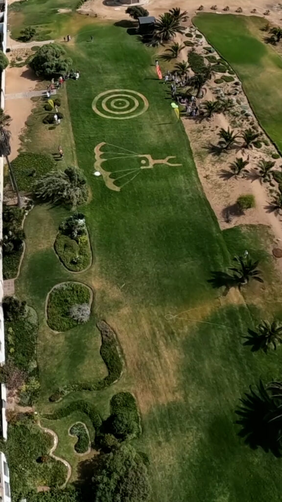 Aerial view of a bullseye landing target mowed into a grass field, skydiving Namibia
