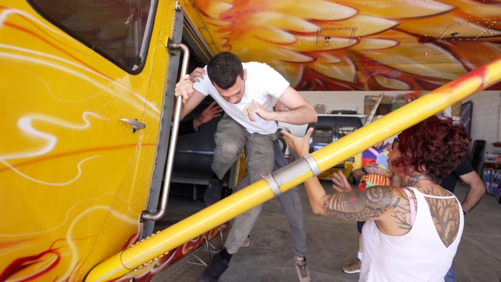 AFF student receiving hands-on exit training from an instructor inside the aircraft at Skydiving Swakopmund, Namibia