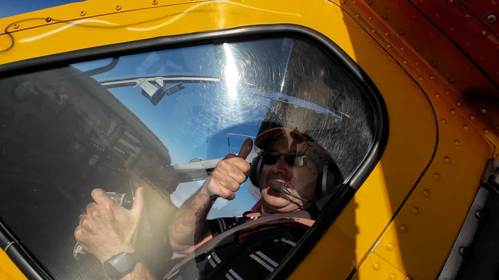 Pilot of The Angel skydiving aircraft giving a thumbs up before takeoff in Namibia