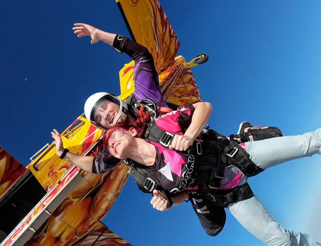 Tandem skydive Swakopmund exit smiling from the plane