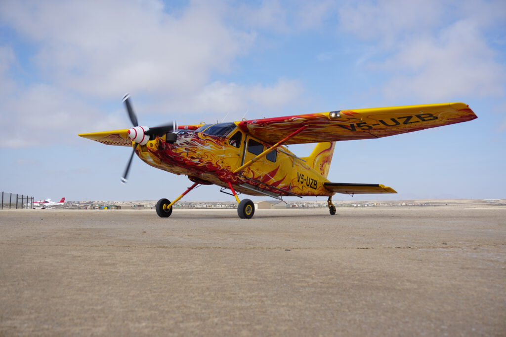 The Angel skydiving aircraft in Namibia, hand painted with a fiery angel and phoenix design